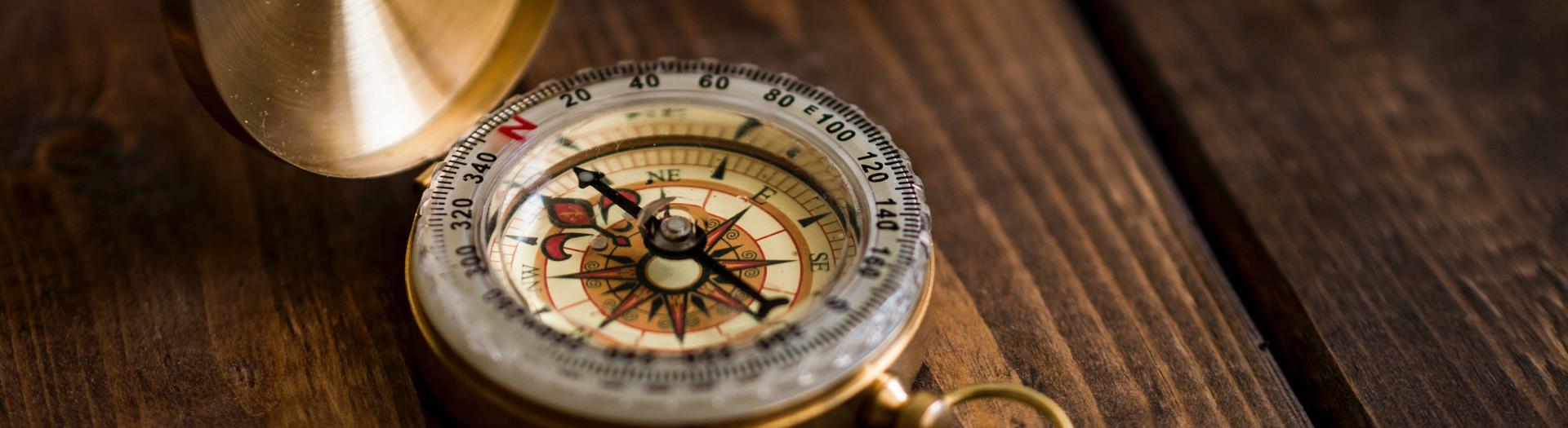 image of a compass on a table